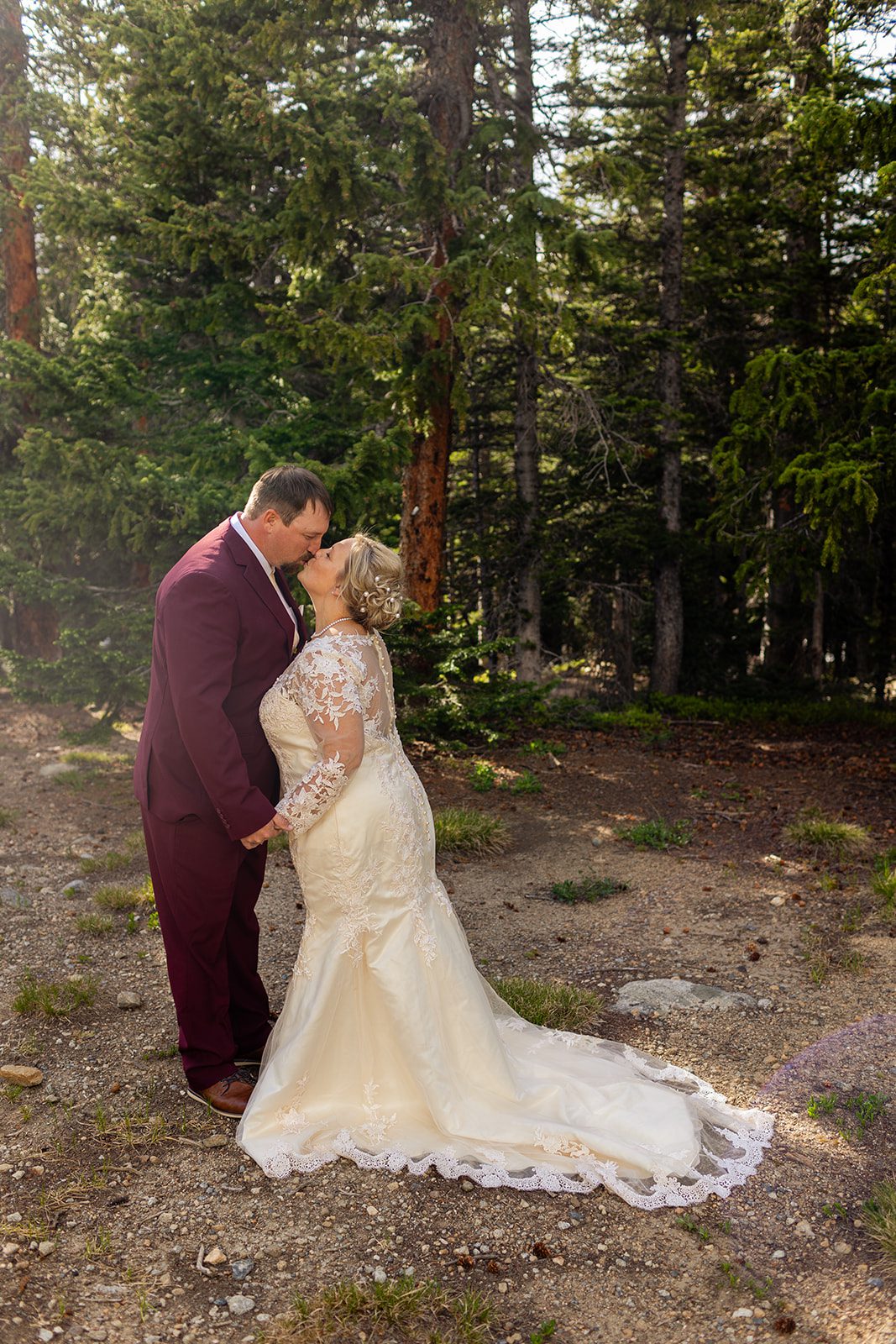 bride and groom kissing on their Brainard Lake wedding day.