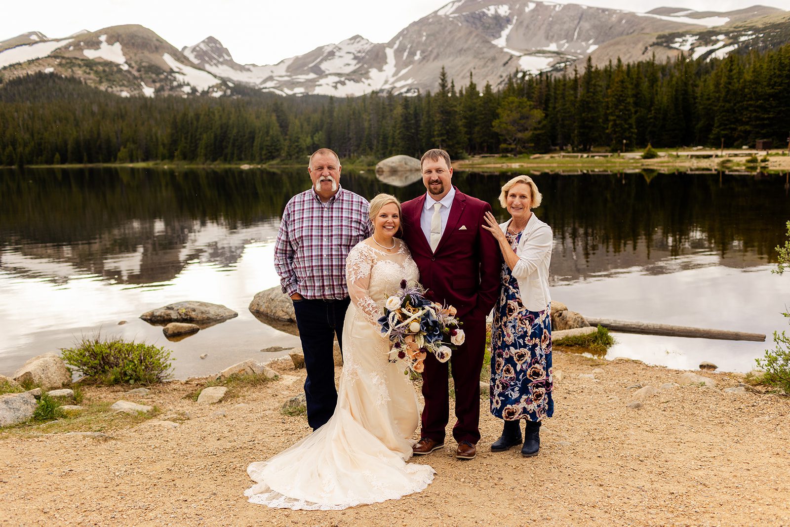 The bride and groom with the grooms parents at Brainard lake.