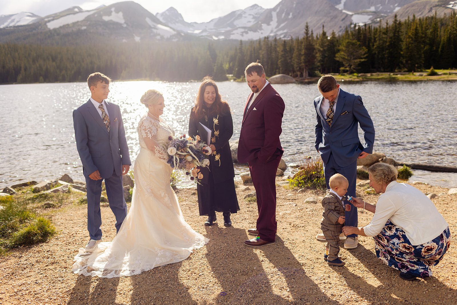 bride and groom with family during their Brainard Lake wedding ceremony