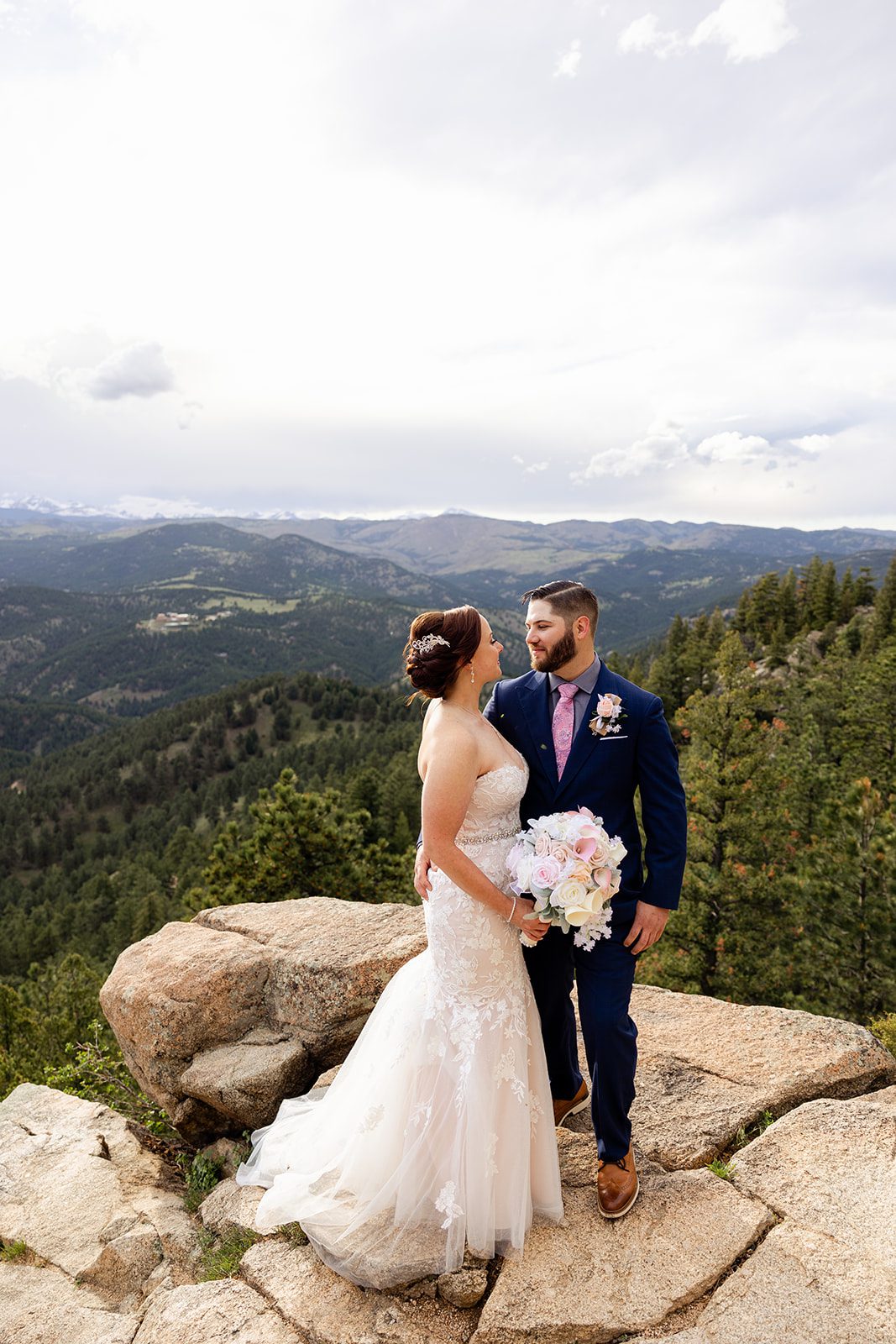 Bride and groom on top of Dream Point overlook during their Boulder elopement with videography.