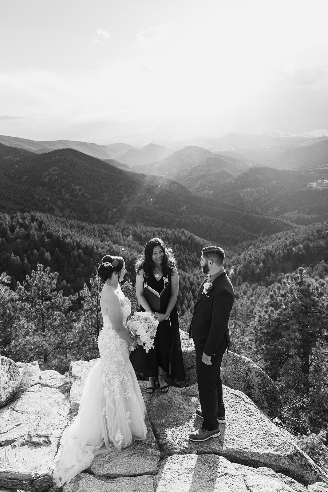 a black and white photo of the bride and groom during  their Boulder elopement ceremony with videography.