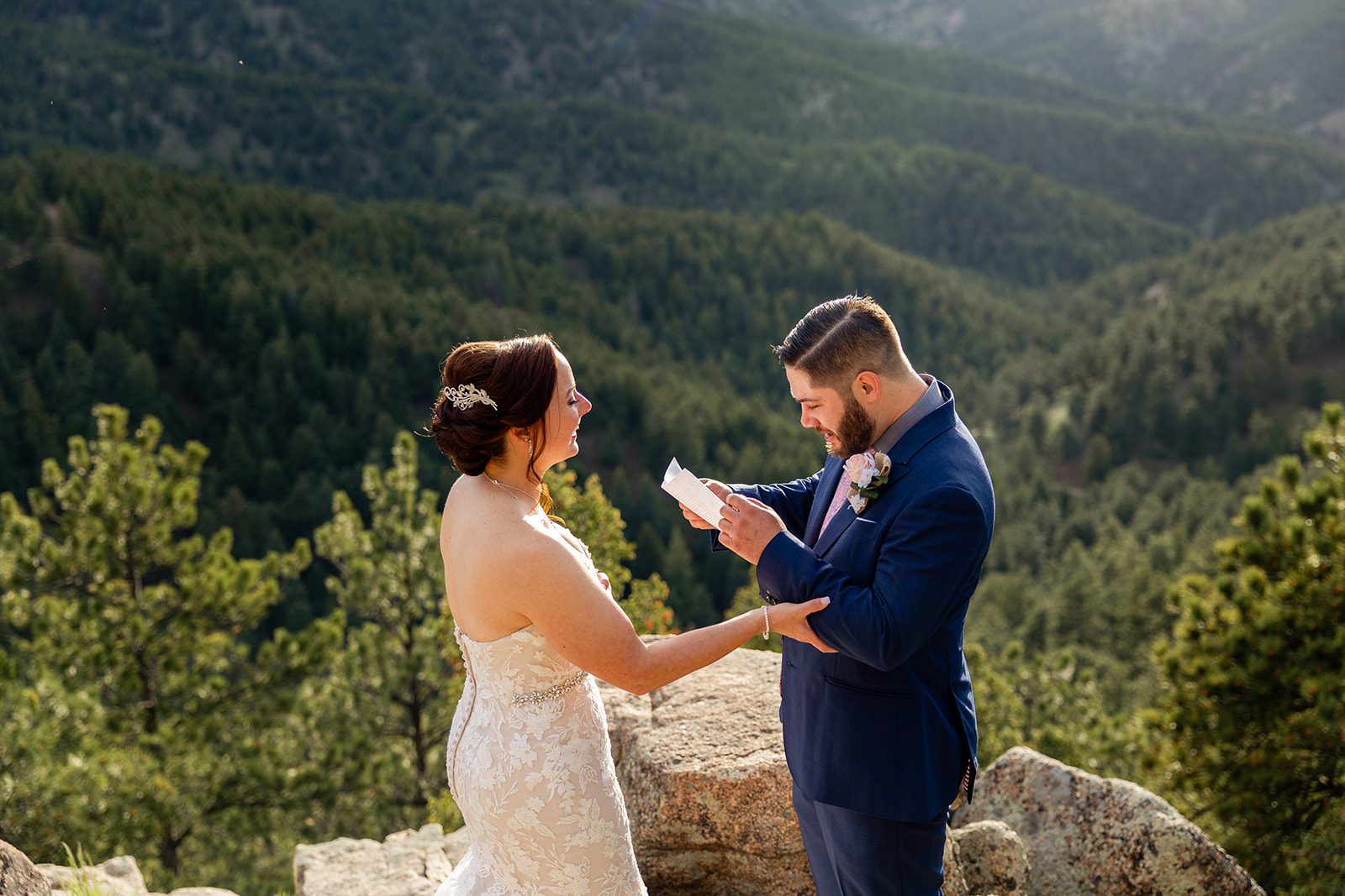Groom reads his vow during their  their Boulder elopement ceremony with videography.