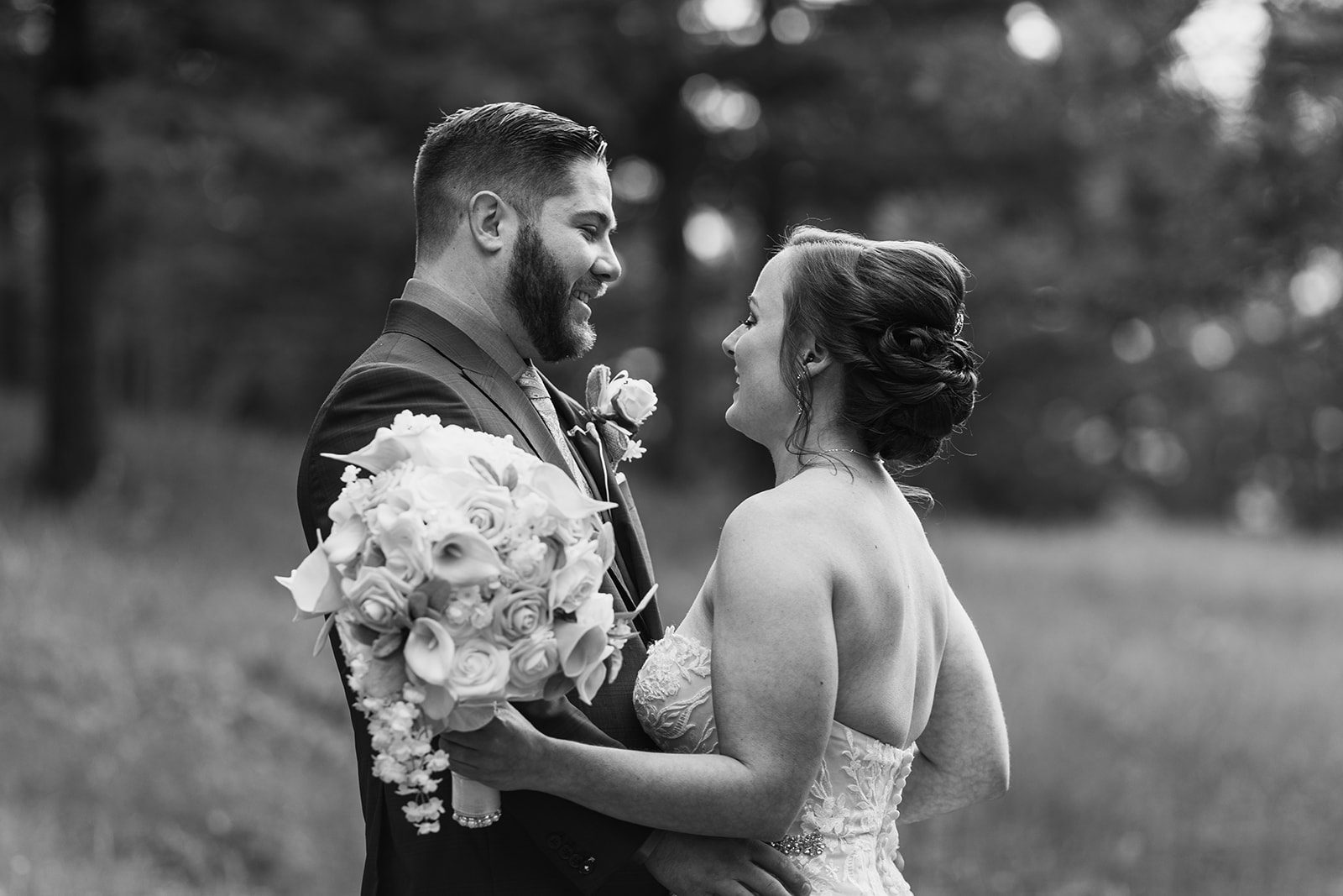 a black and white photo of the bride and groom looking at each other during their Boulder elopement with videography.