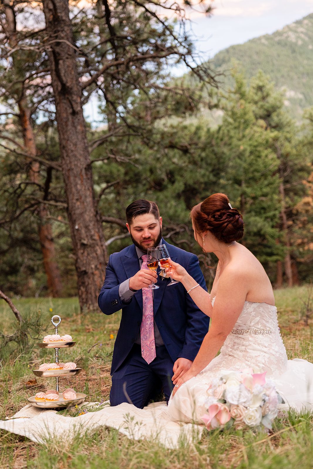 bride and groom toasting champagne after their Boulder elopement with videography.
