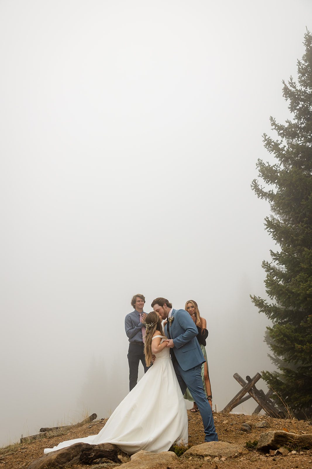 Bride and groom ceremony kiss at Estes Park Colorado Hidden Valley Elopement in Rocky Mountain National Park