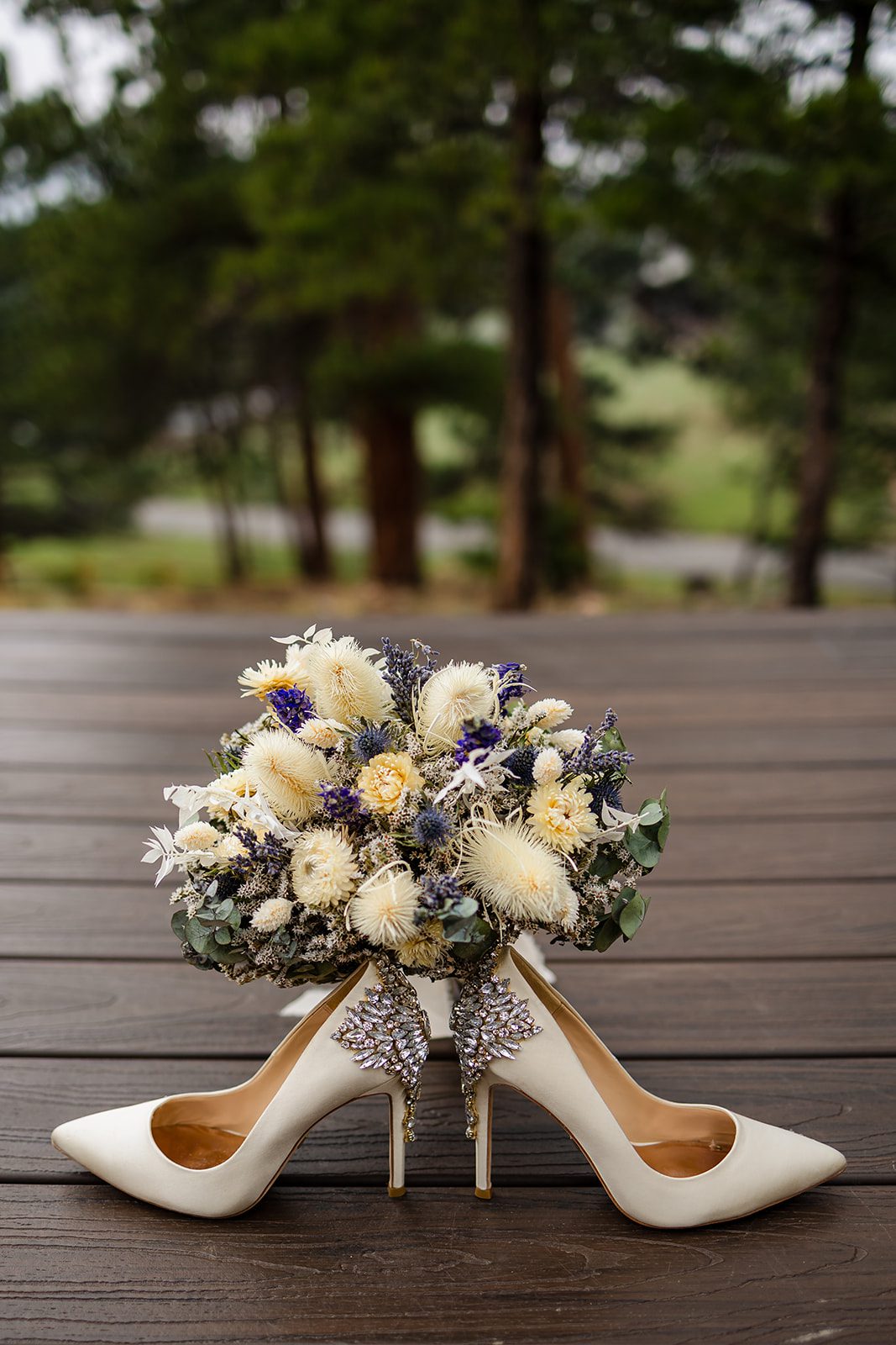 Bride's white shoes and bridal bouquet from her Hidden Valley elopement day. 
