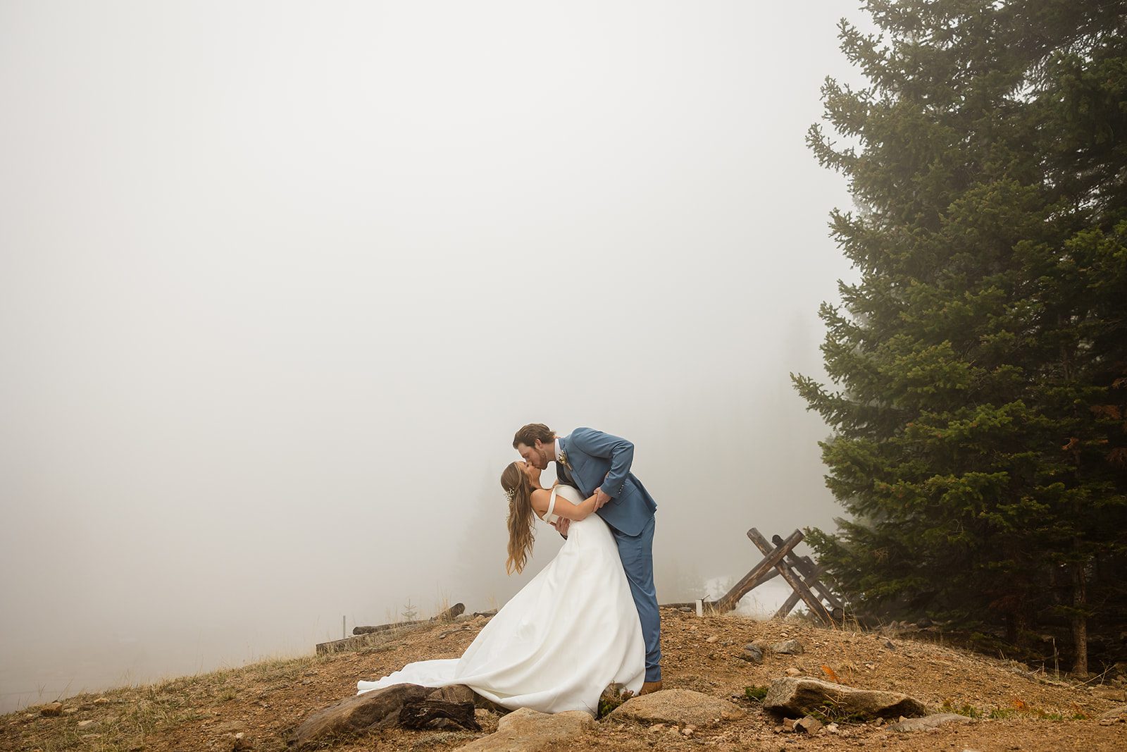 Bride and groom first kiss at Estes Park Colorado Hidden Valley Elopement in Rocky Mountain National Park