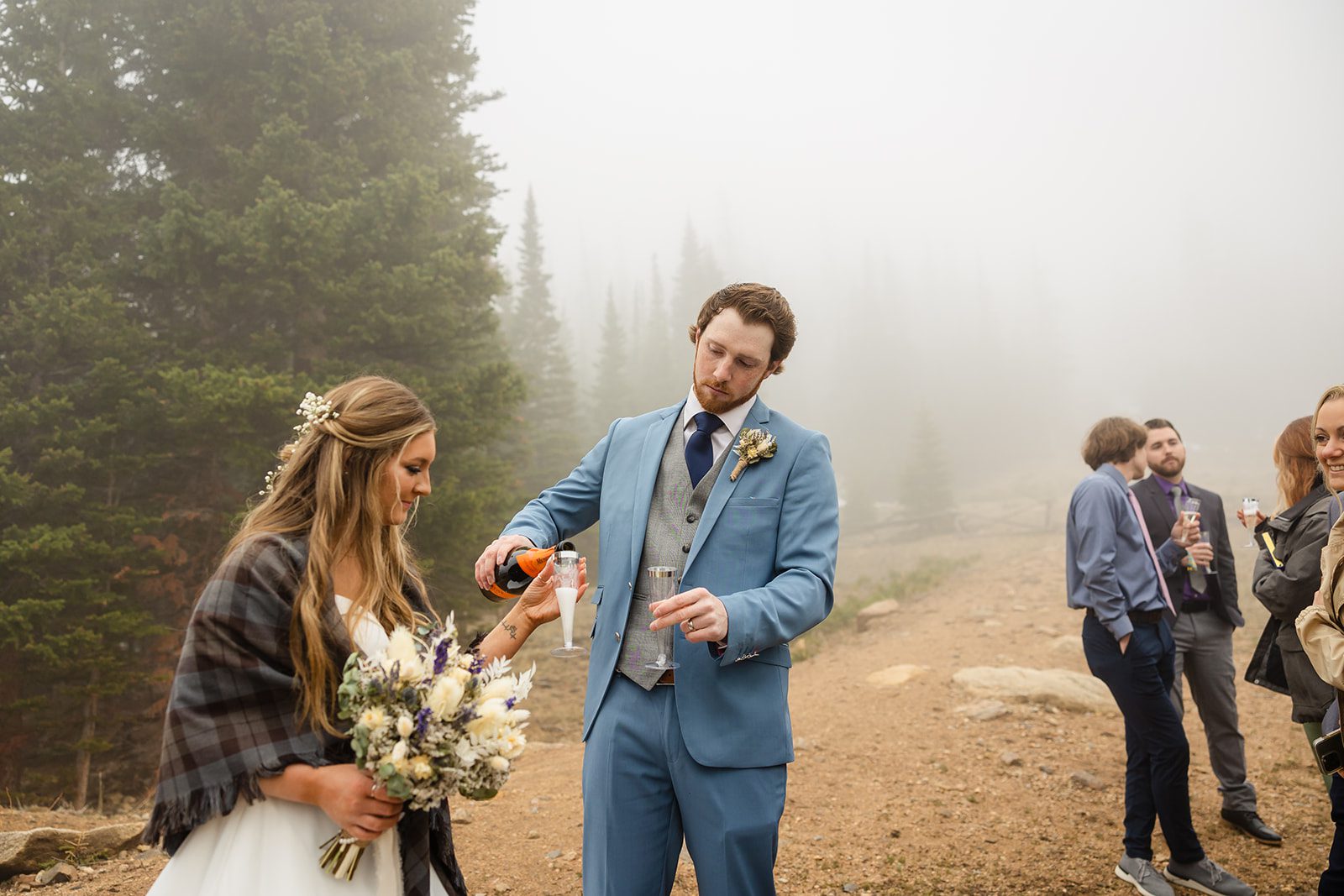 Elopement toast with guests at Estes Park Colorado Hidden Valley Elopement in Rocky Mountain National Park