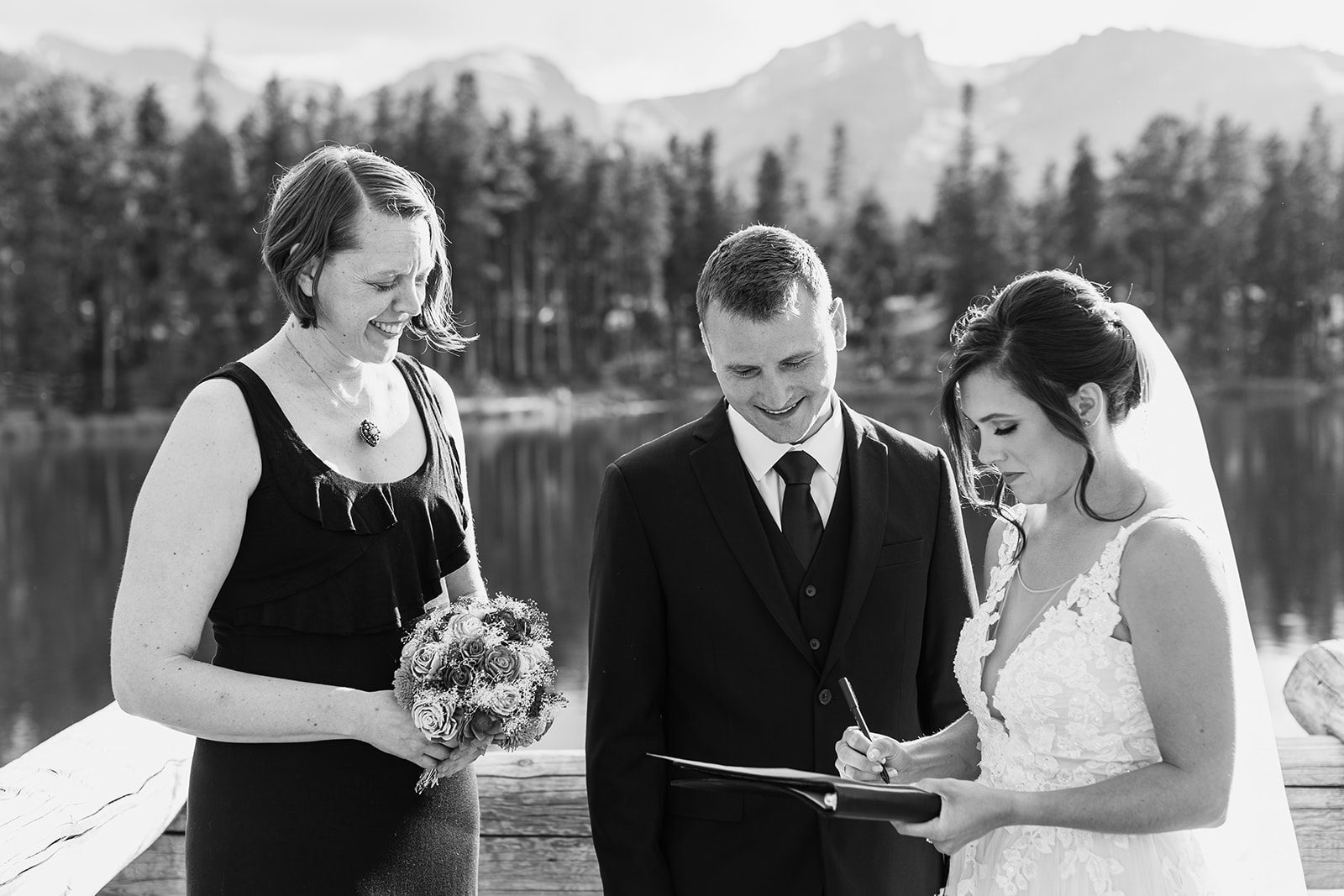 black and white photo, bride sings marriage certificate