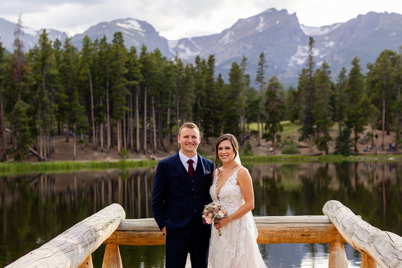 Bride and groom aft Sprague Lake after their elopement ceremony