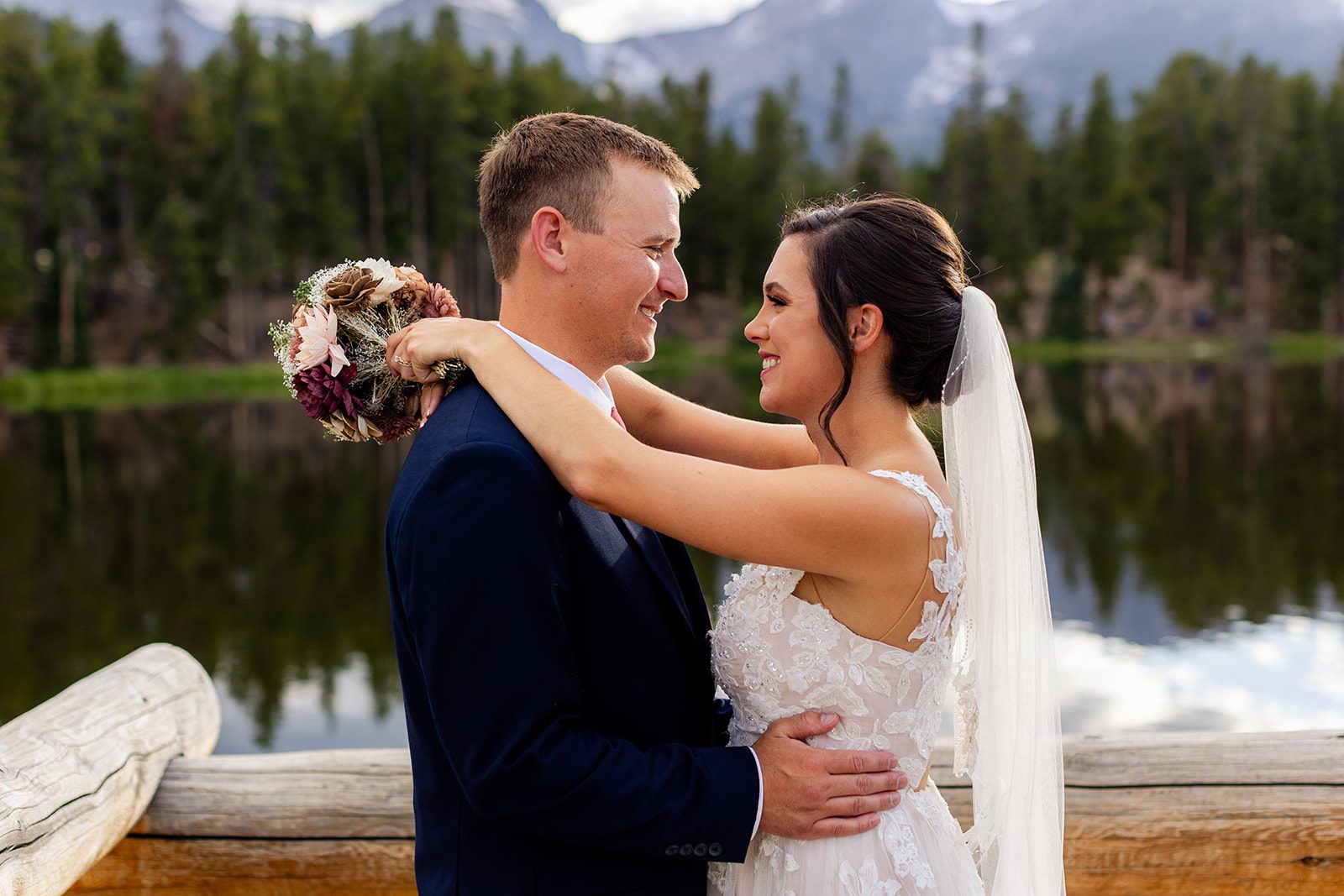 bride and groom looking at each other, in Rocky Mountain National park