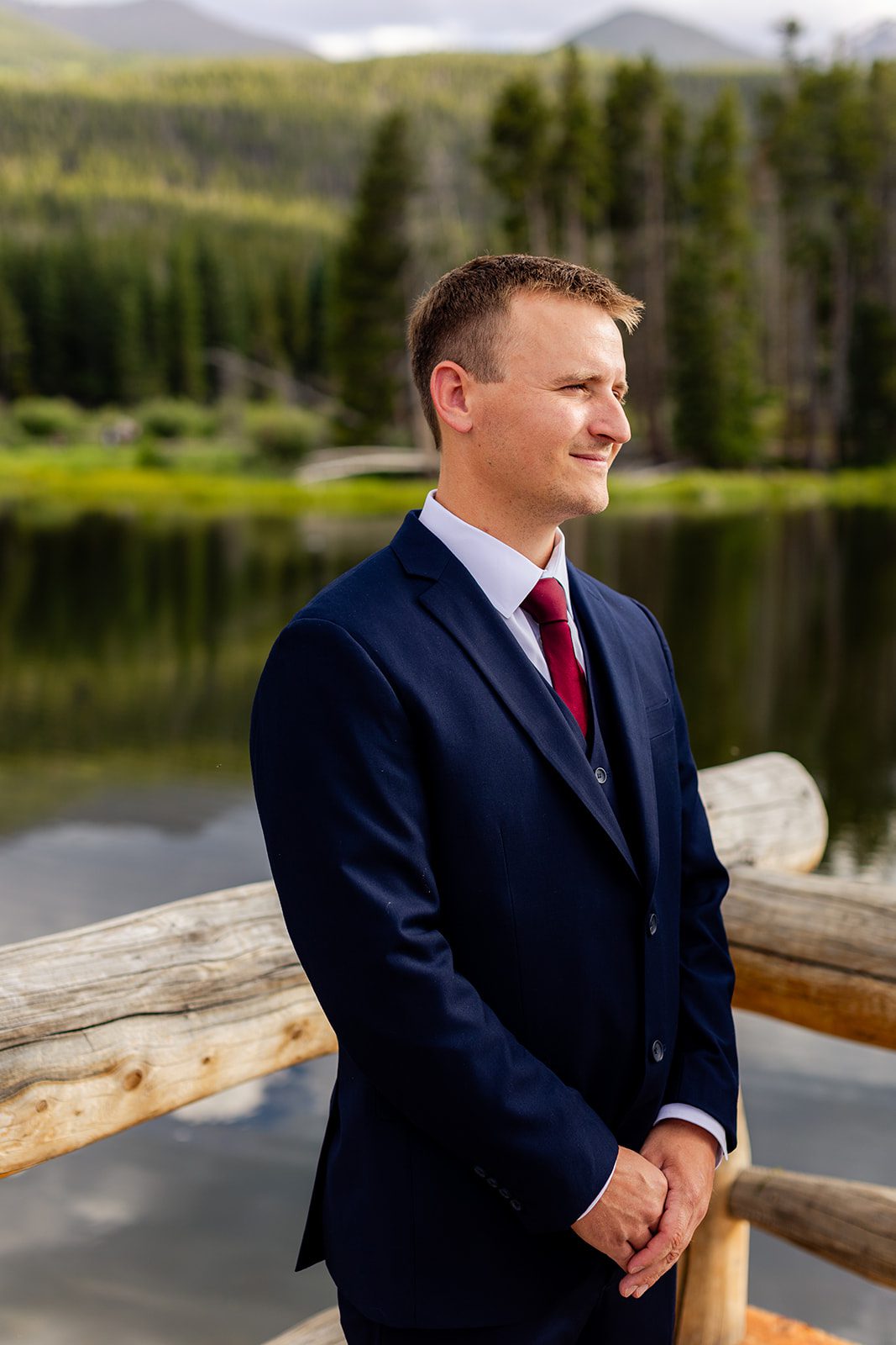 Groom in blue suit during Sprague Lake elopement