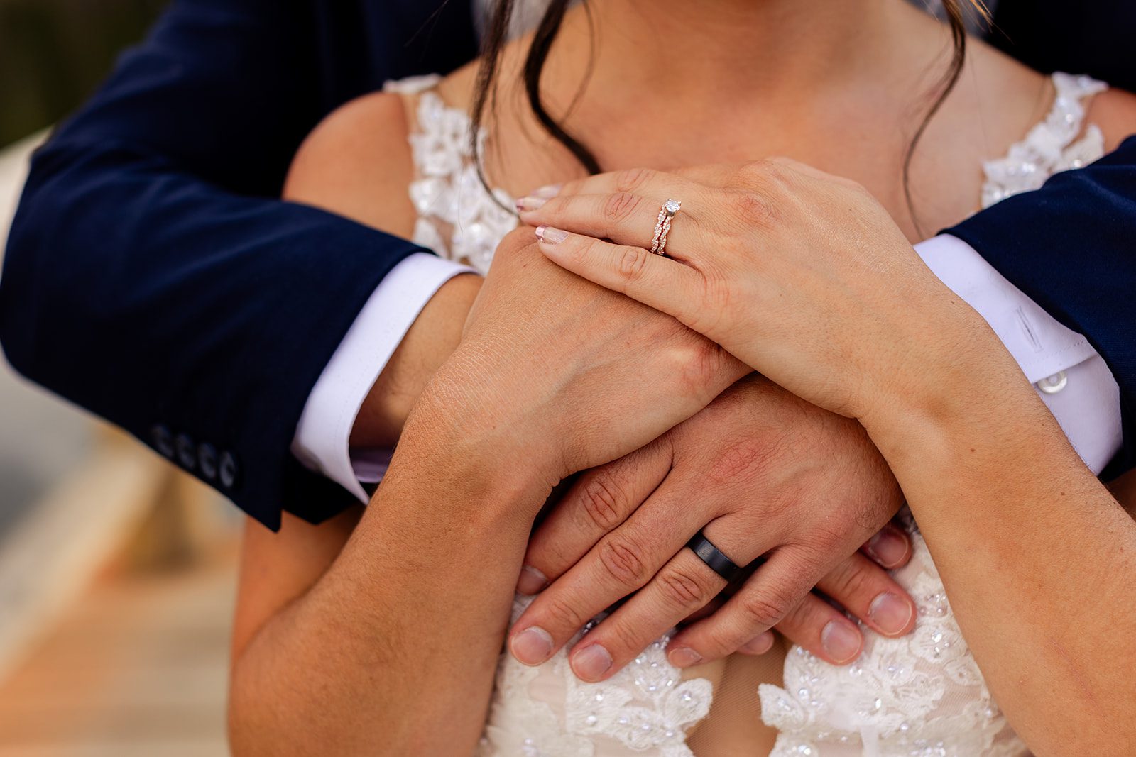 Bride and grooms hands with wedding rings