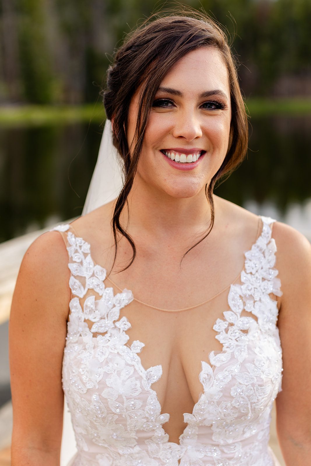 beautiful brunette bride in wedding gown at Sprague Lake