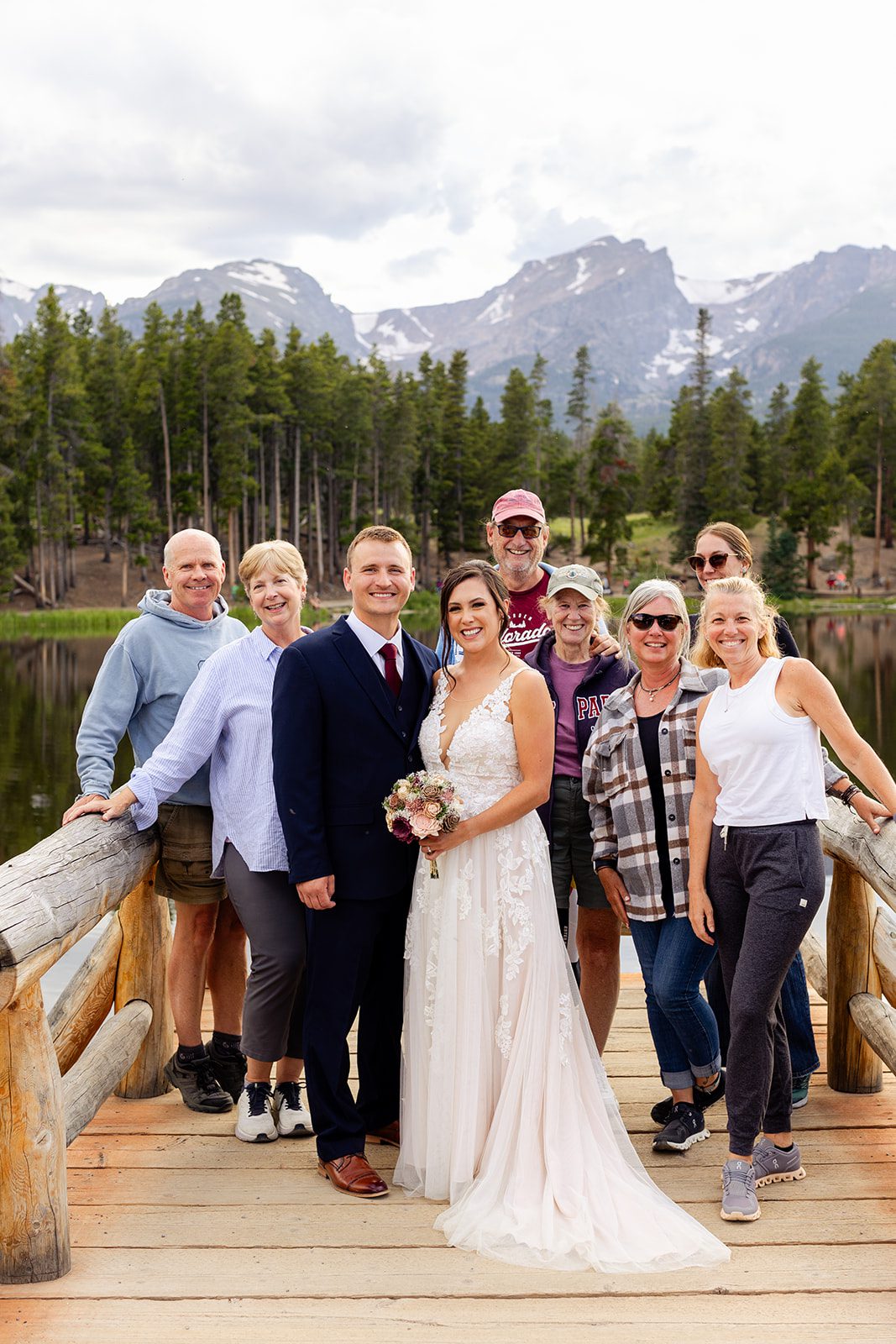 Couple with strangers who became friends after Sprague Lake elopement ceremony
