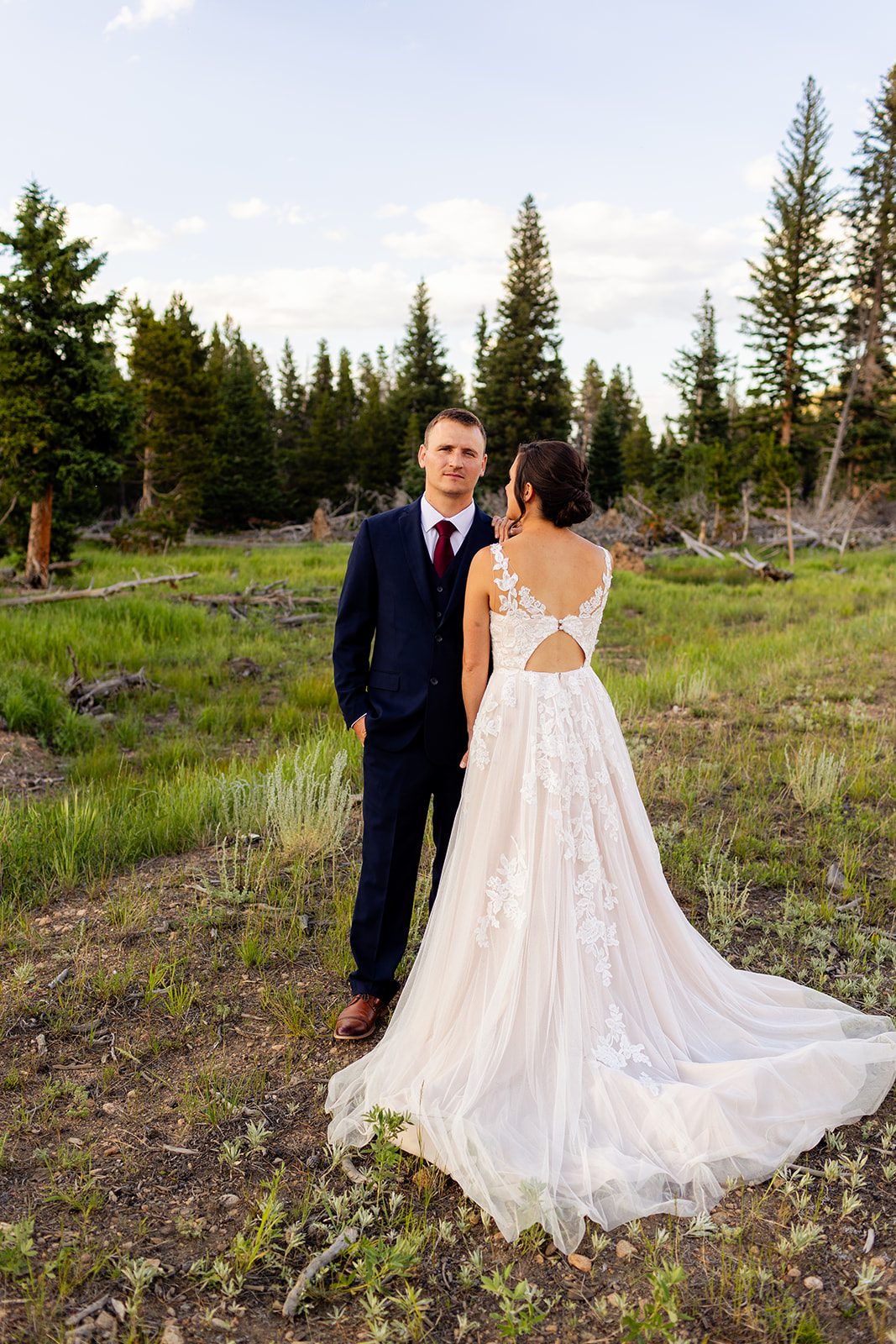 Bride faces groom during their summer elopement at Sprague Lake