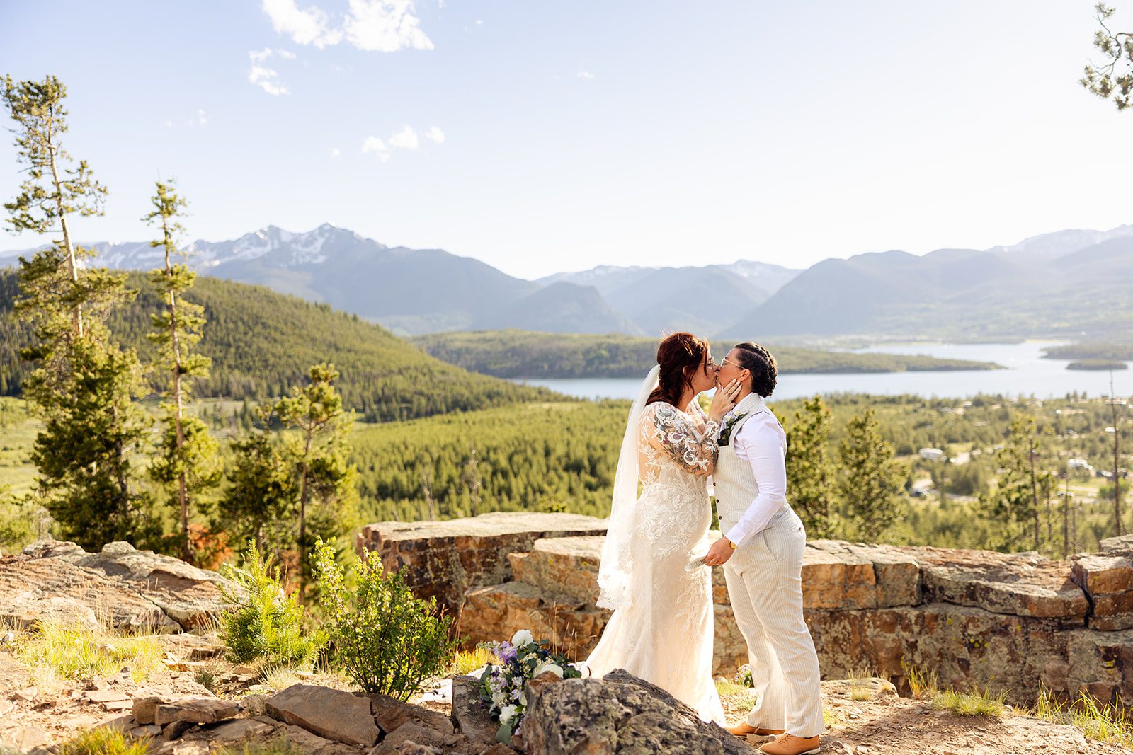 LBGTQ couple kissing during  Summit County Elopement. 