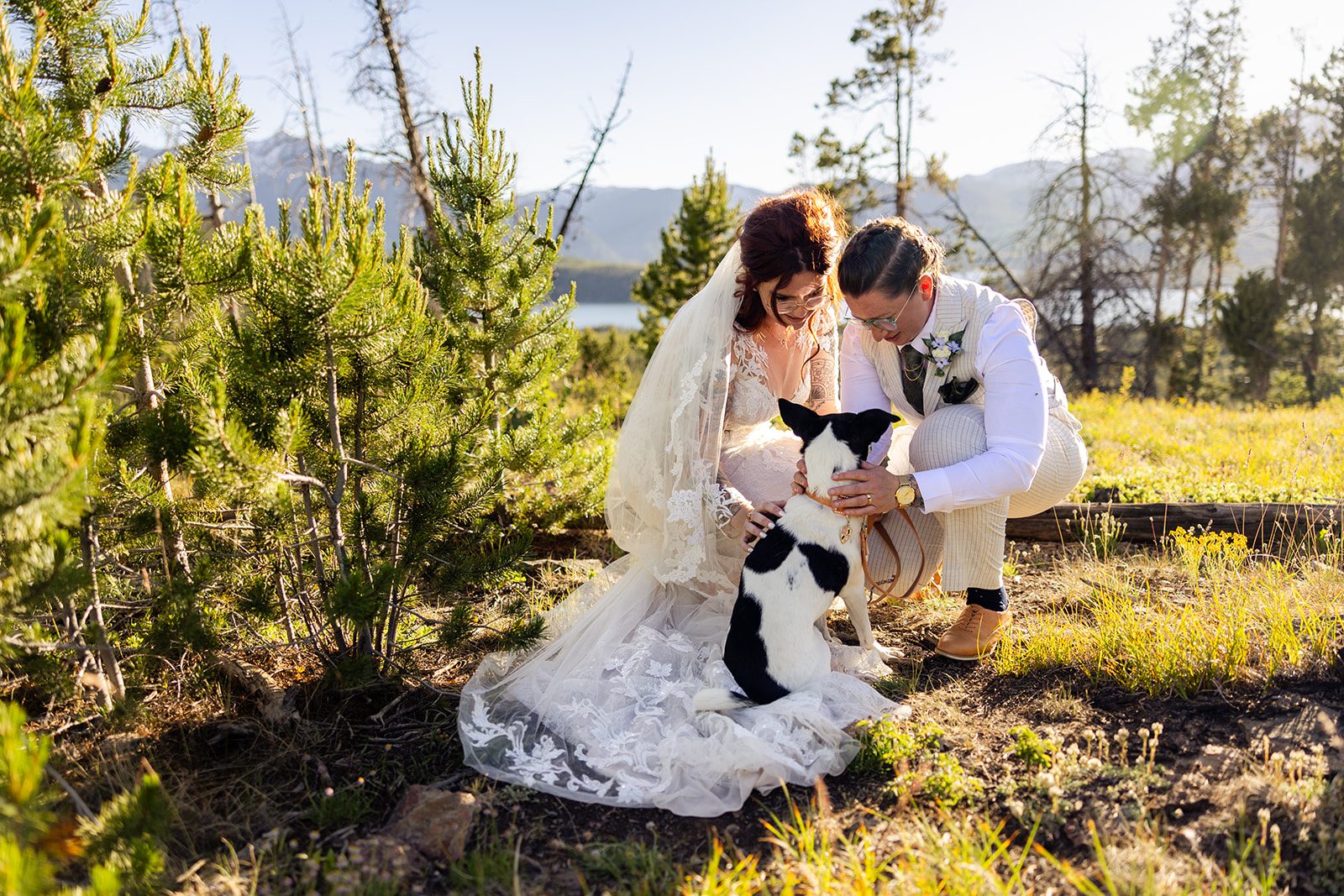 brides giving dog love during their Summit County Elopement