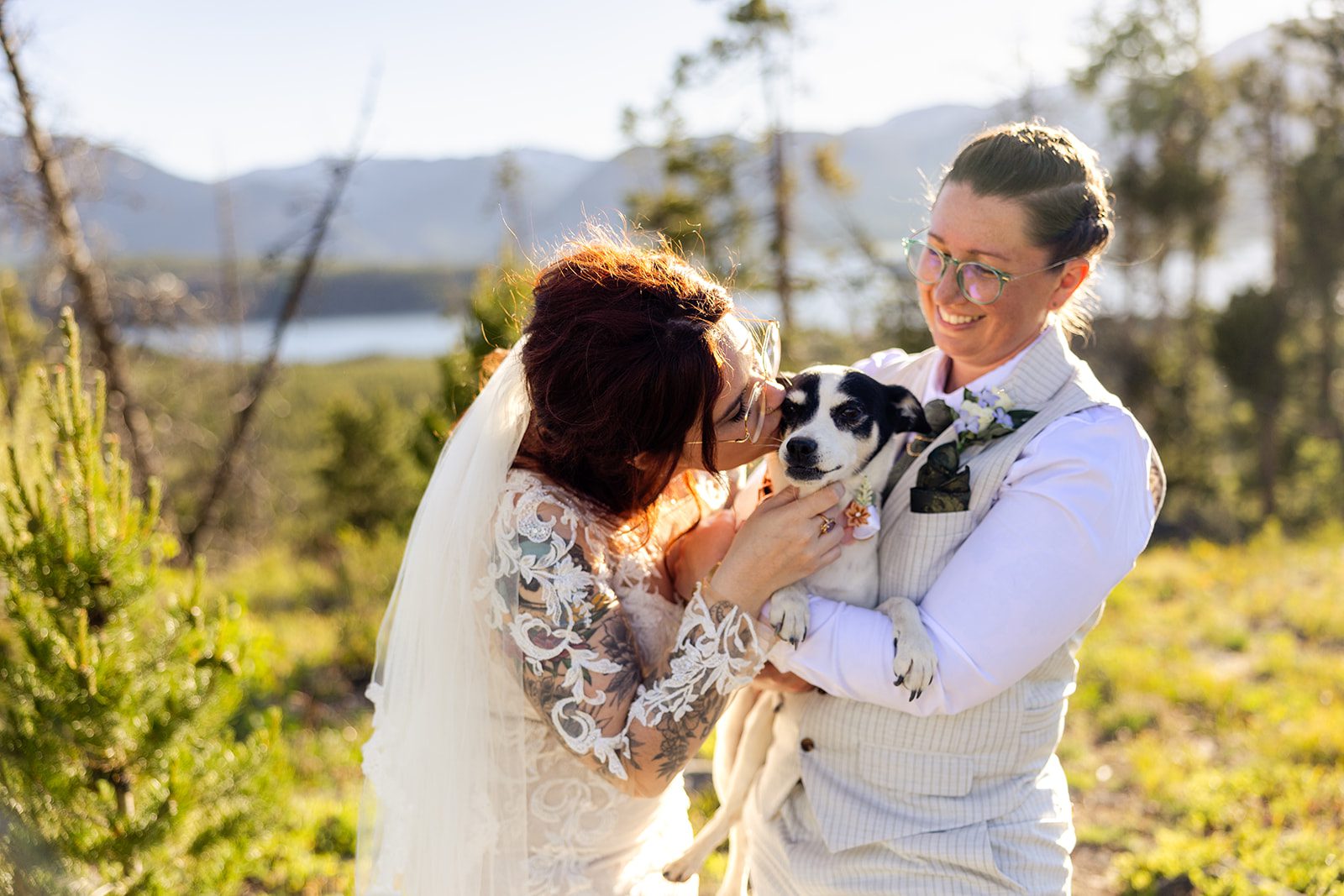 bride kissing dog at Summit County Elopement.