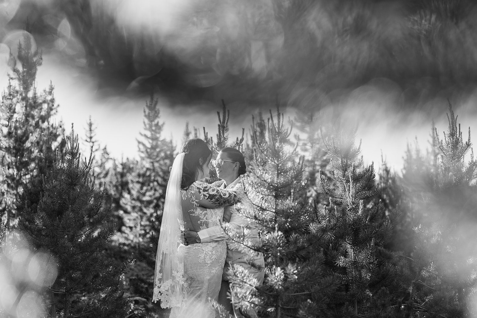 black and white photo of two brides at Summit County Elopement at sunset. 
