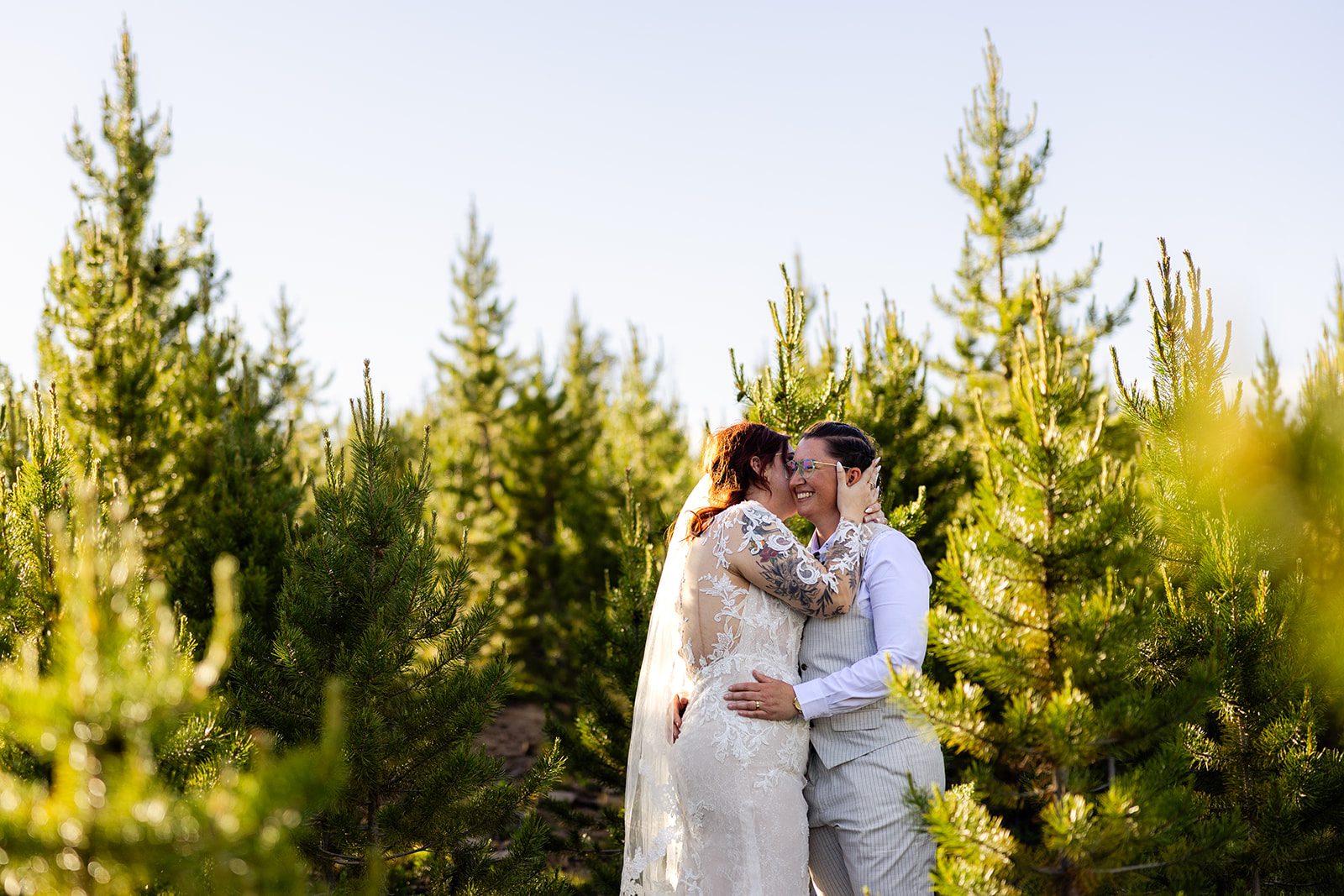 two brides holding each other during their Summit County Elopement day. 