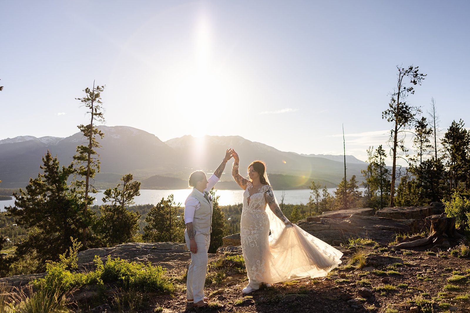 two brides dancing in the sunset at after elopement in Colorado. 