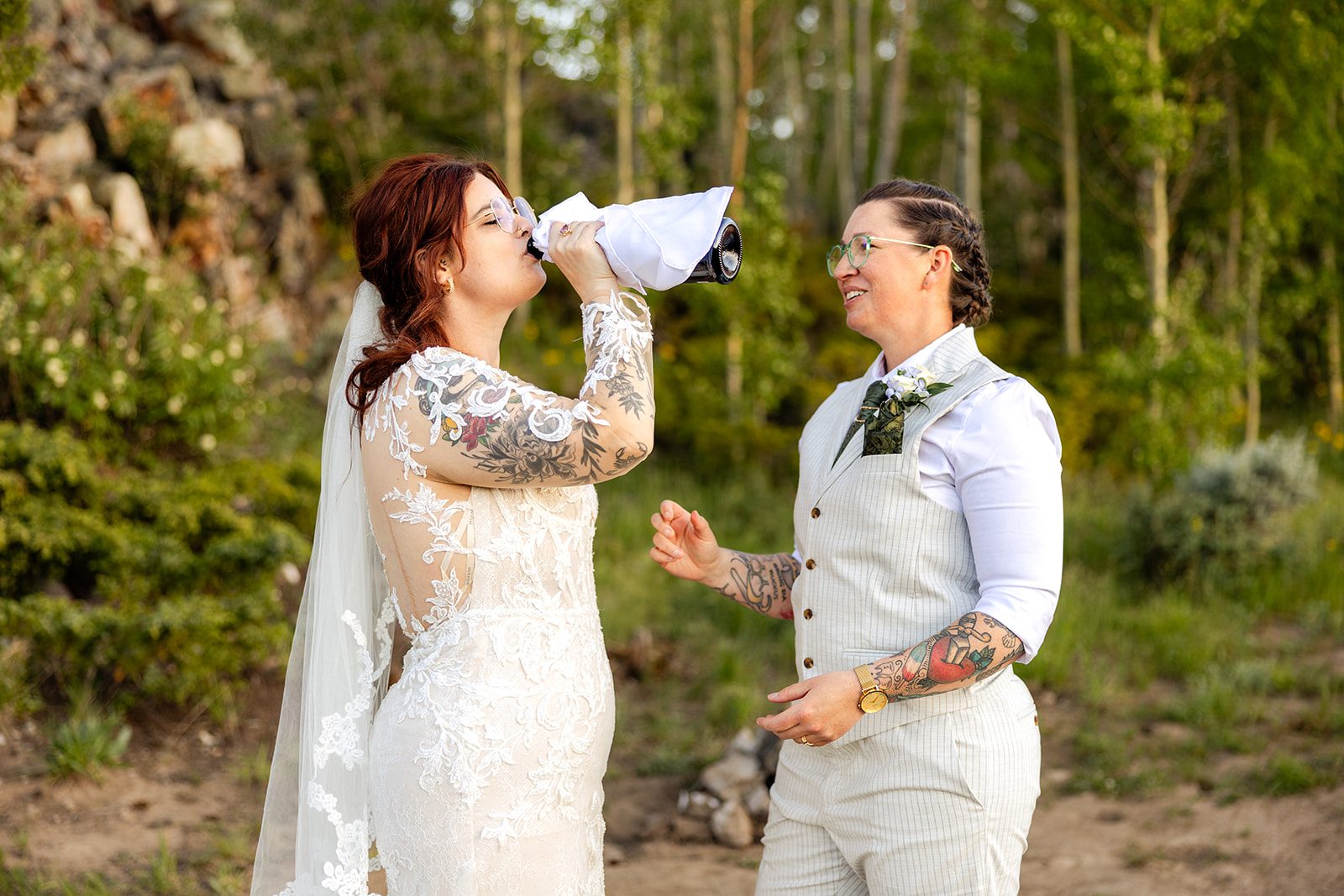 bride drinking champagne at Summit County Elopement. 