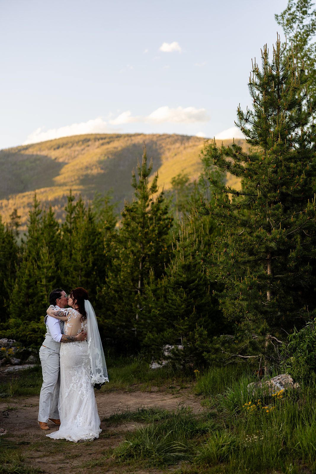 brides hug during Summit County Elopement