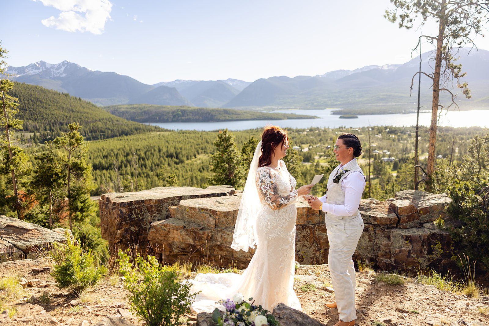 Reading vows at sunset  during Summit County Elopement