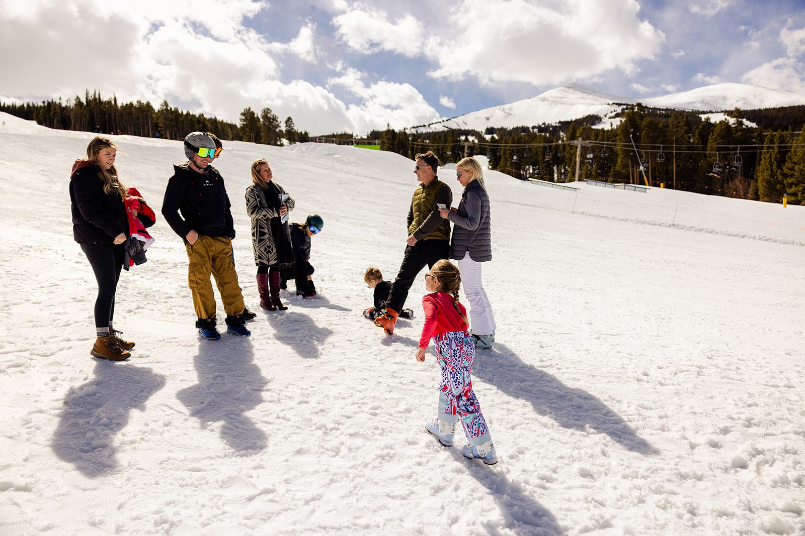 Family on the mountain in Breckenridge at the ski resort their Colorado Vow Renewal ceremony.