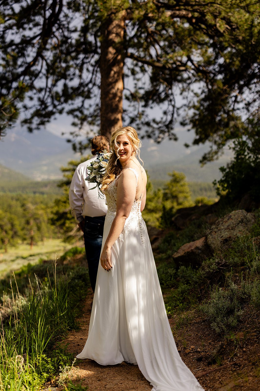 Bride before doing a first look with her father before her elopement at 3M Curve in Rocky Mountain National Park.