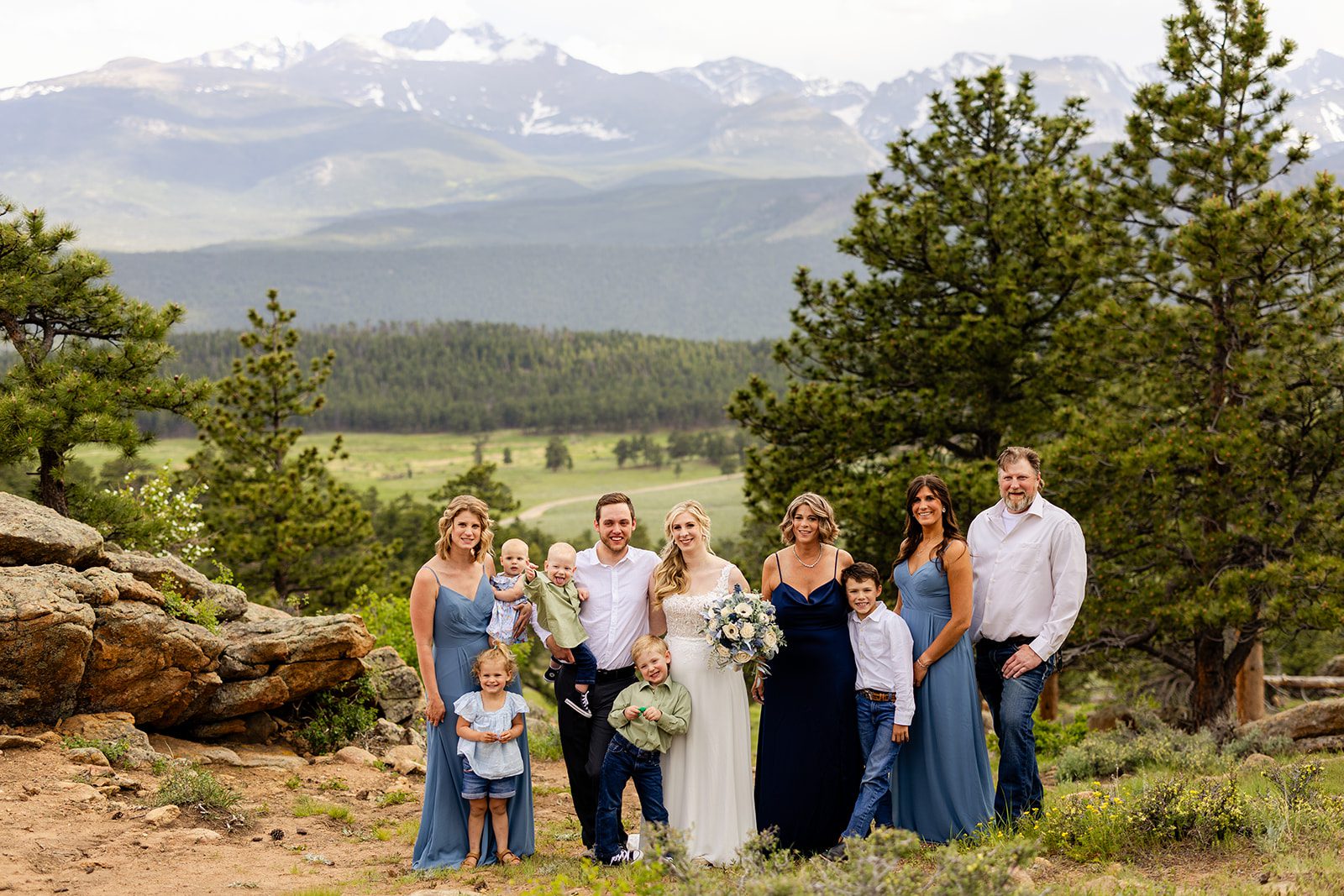 family photo with bride and groom in rocky mountain national park, after summer elopement.