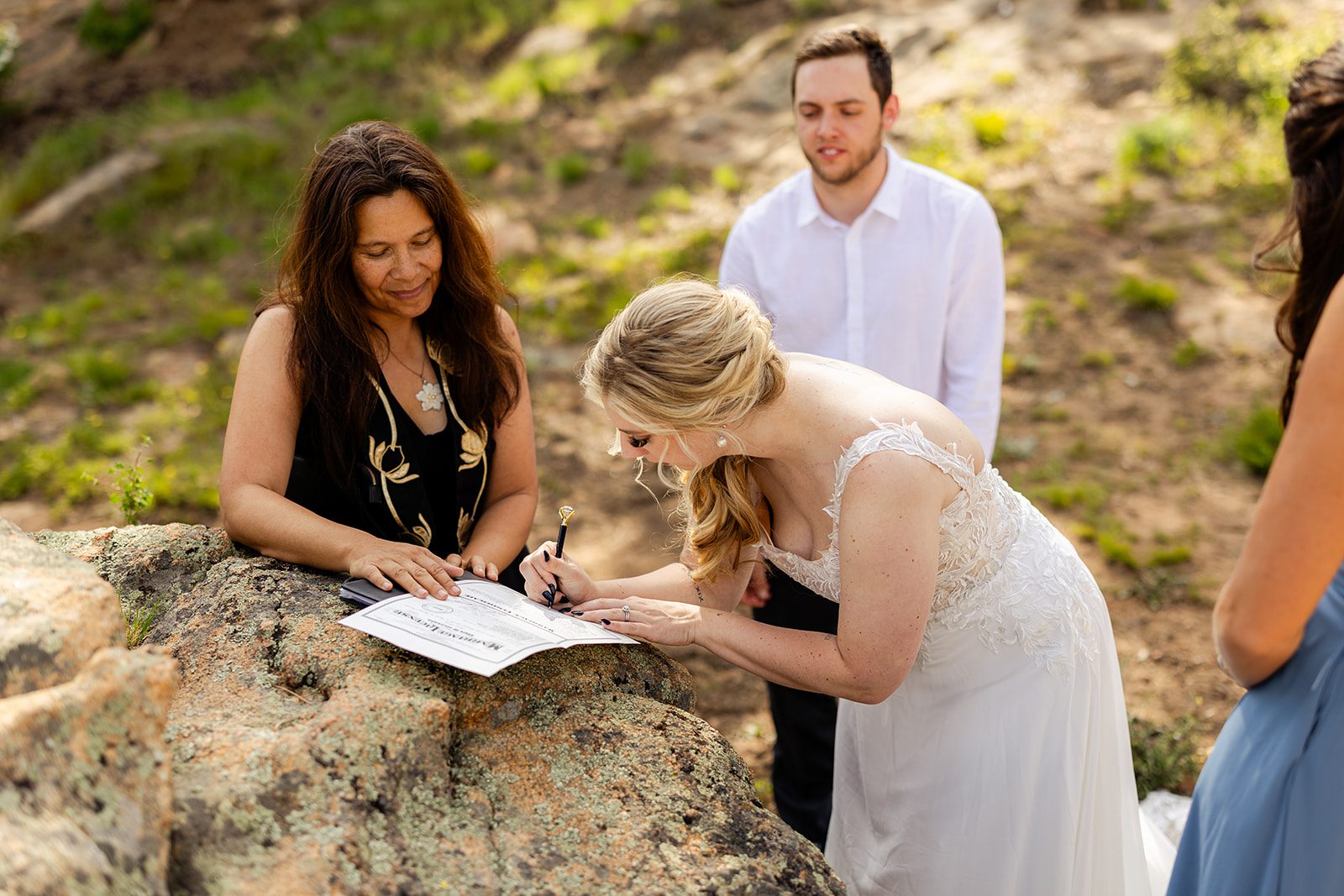 bride signing marriage license after 3m curve elopement ceremony.