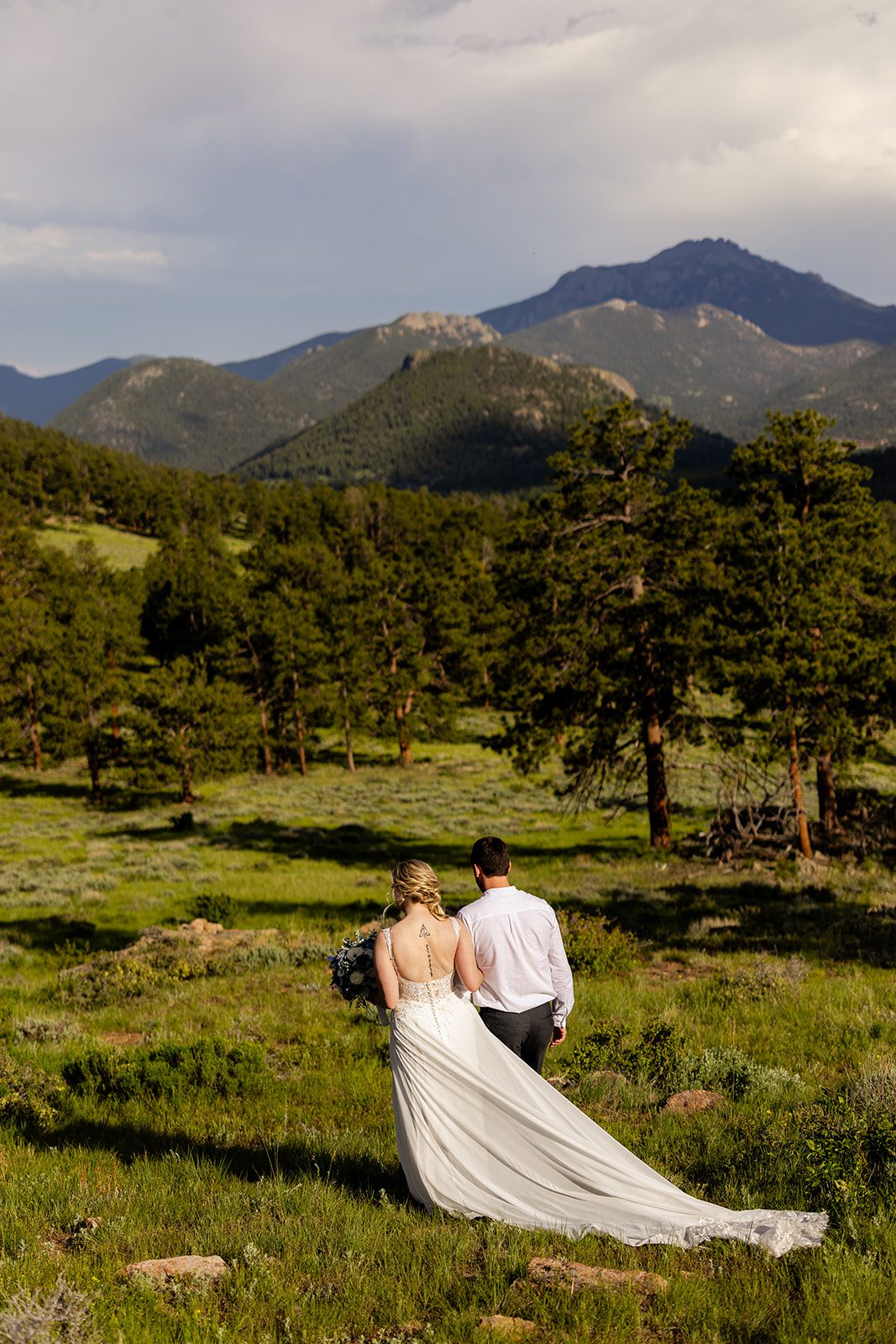 bride and groom walking in rocky mountain national park after 3m curve elopement.