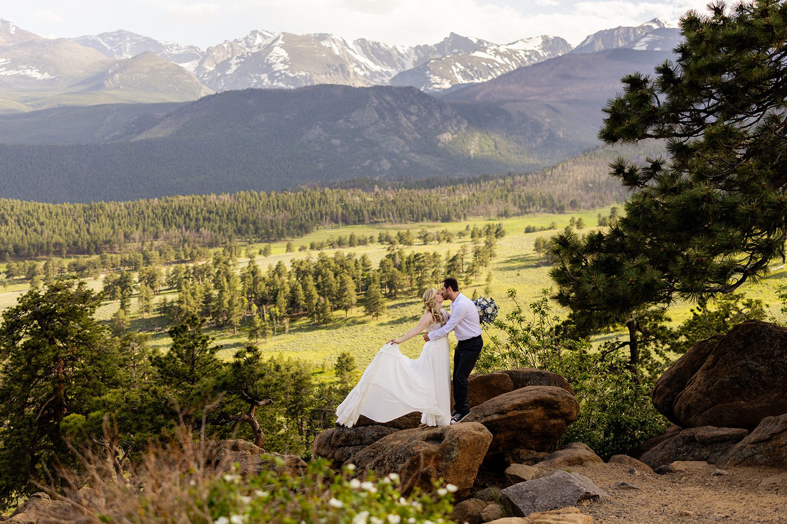 bride and groom on boulder at 3M curve afte their elopement ceremony.