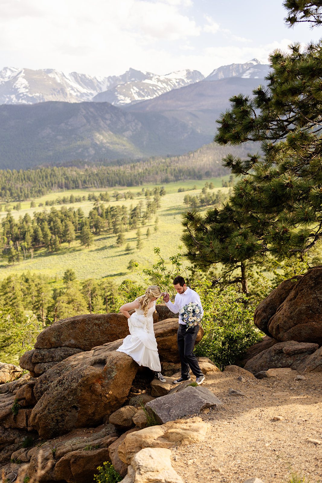 bride and groom at 3m curve in Rocky Mountain National Park.