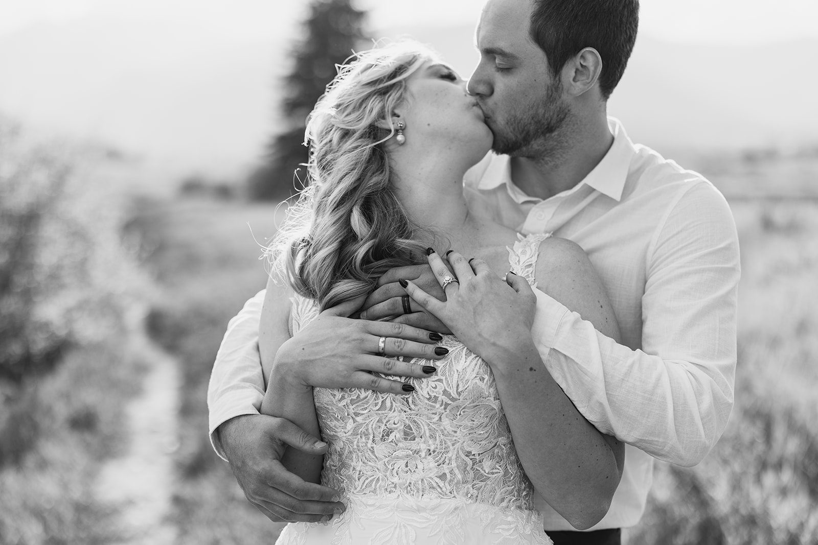 black and white photo bride and groom kissing after 3m curve elopement