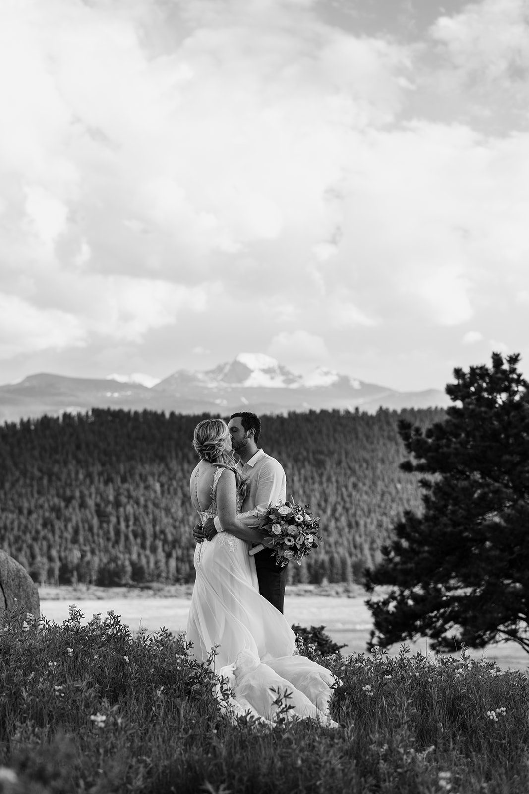 black and white photo of bride and groom in 3m curve
