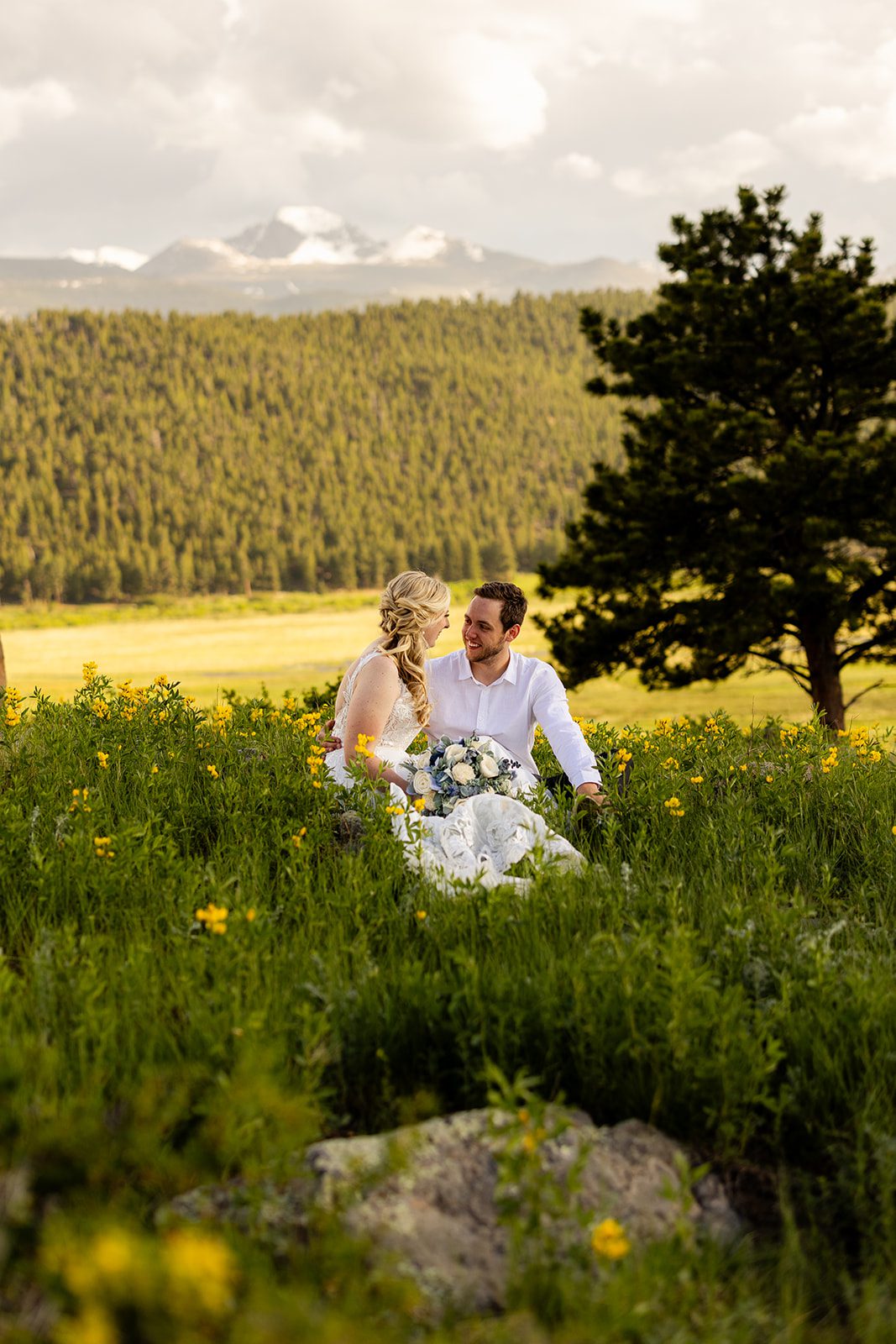 bride and groom in meadow in 3m curve for their summer elopement.