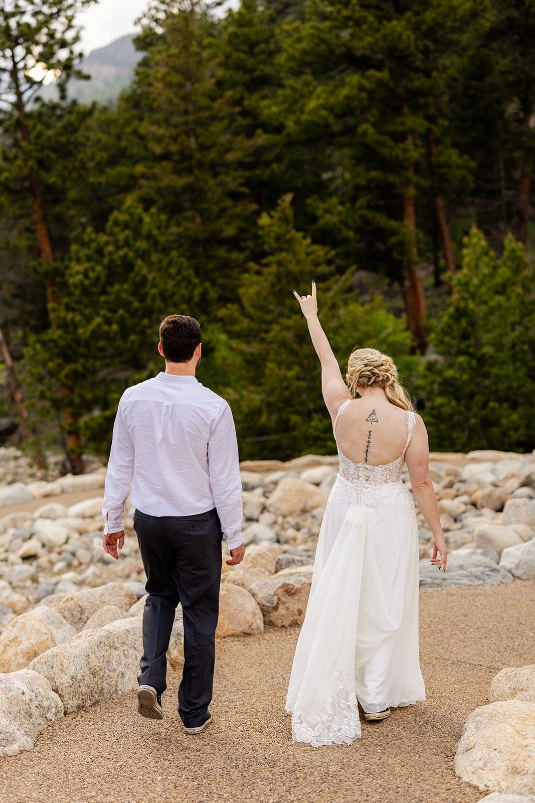 bride and walking at alluvial Fan Bridge & Waterfall after 3m curve elopement ceremony 