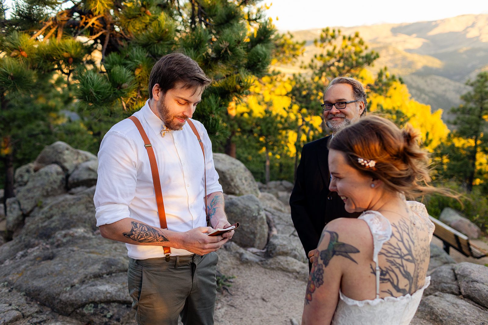 bride giggling as groom reads his vows during Sunrise Elopement at Artist Point