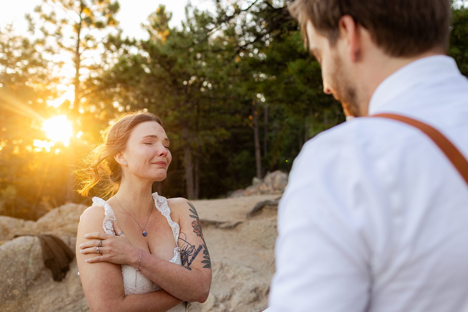 bride crying as groom reads his vows during elopement ceremony at Sunrise at Artist Point