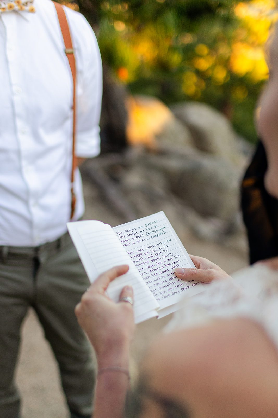 Bride holding vow book