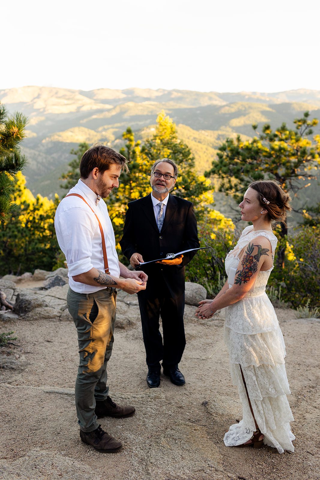 Groom with ring for his bride during elopement ceremony
