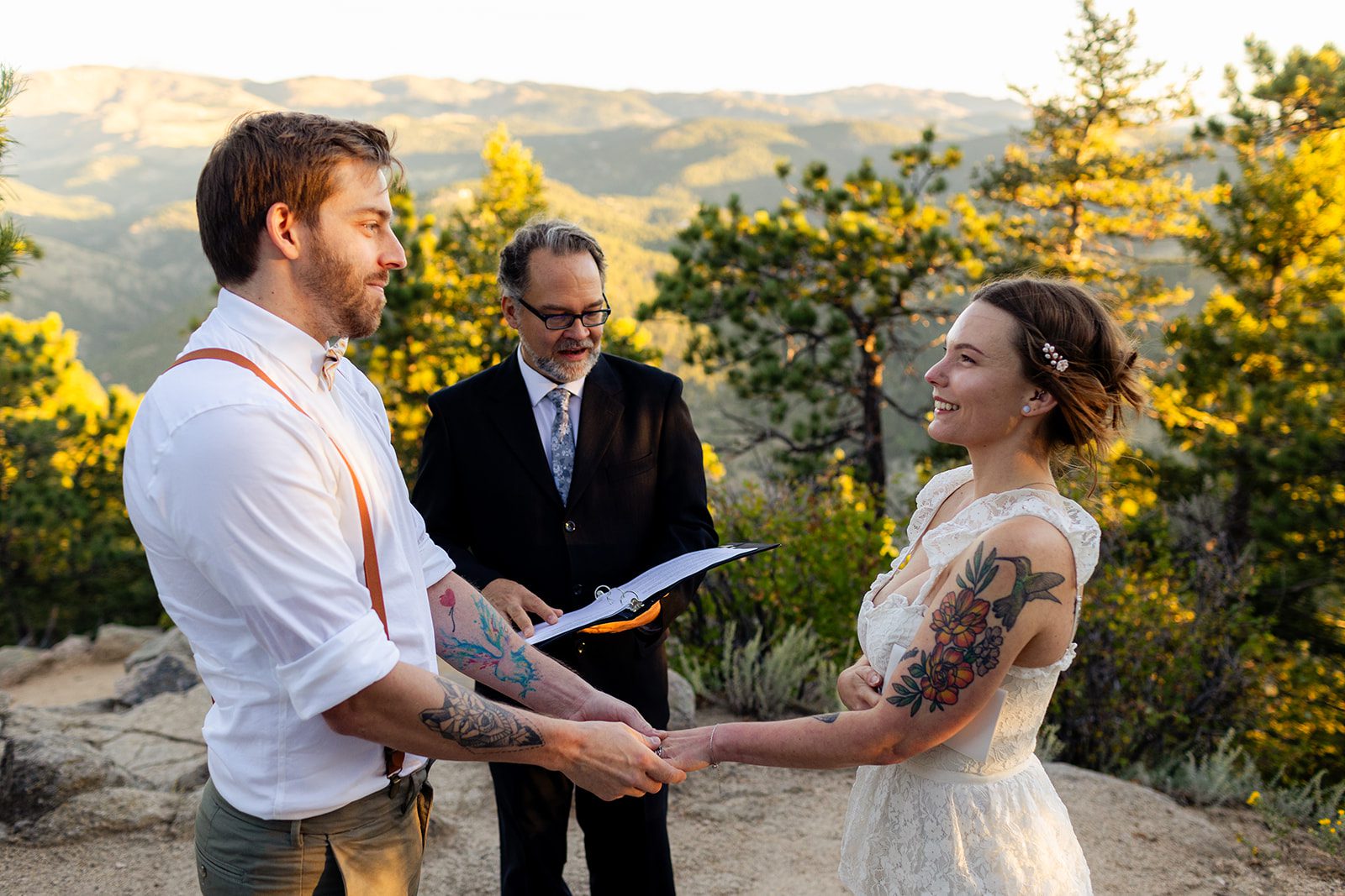bride and groom smiling holding hands during Sunrise Elopement at Artist Point