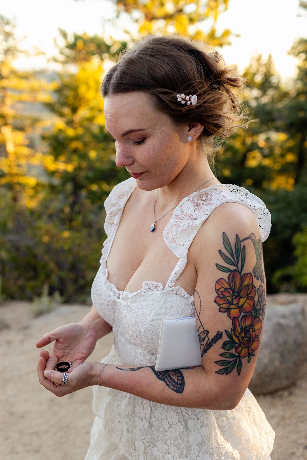 bride with rings at sunrise elopement in Artist point