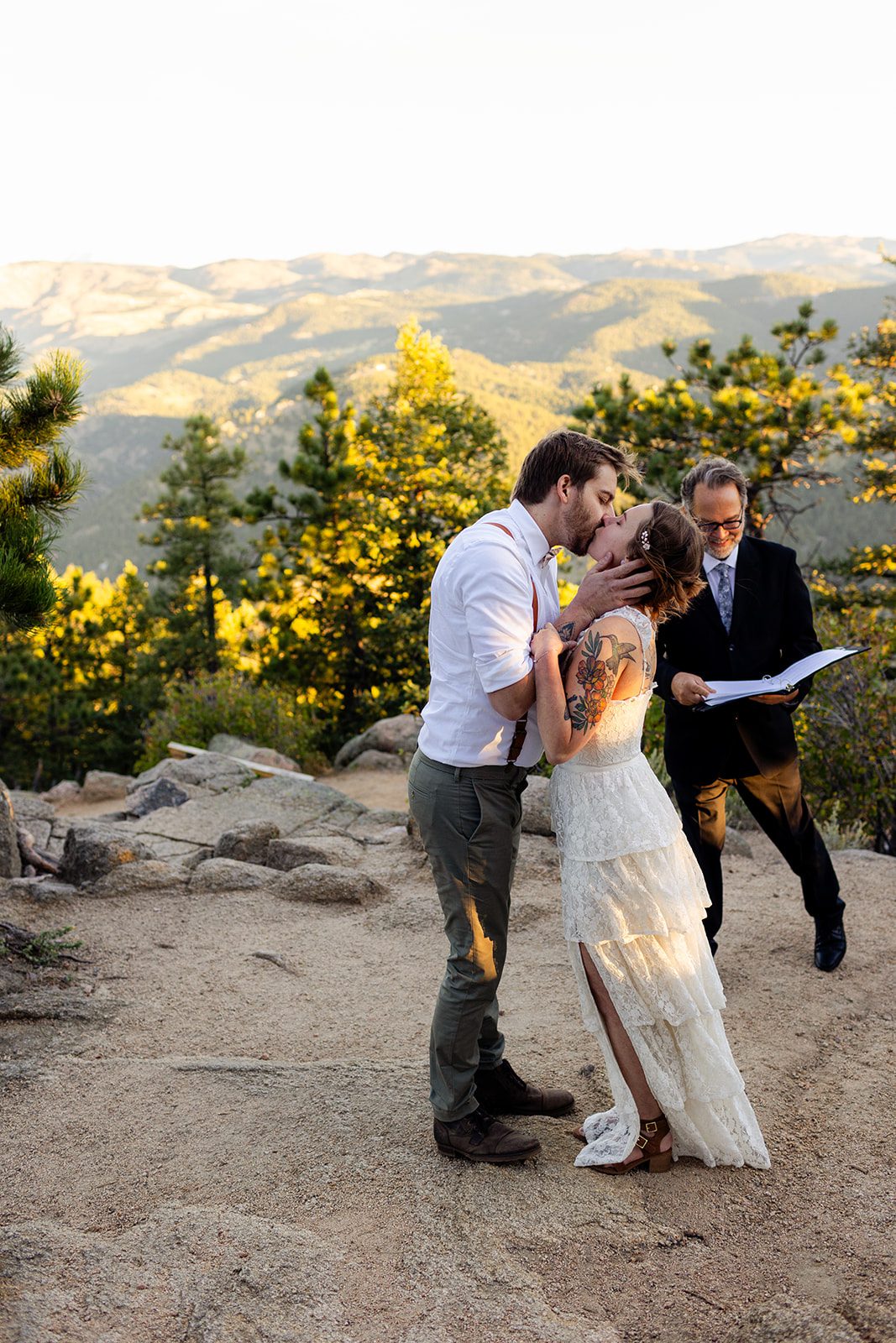 Bride and groom kiss for the first time at sunrise elopement at Artist Point