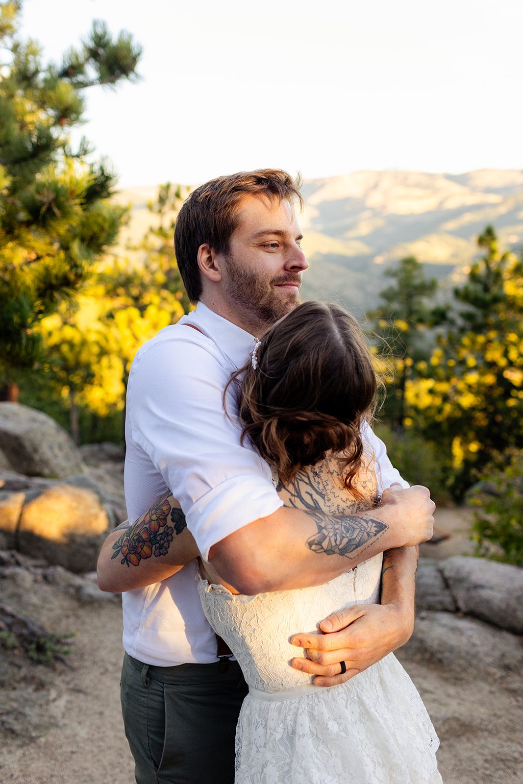 Bride and groom hugging at Artist point after their elopement ceremony