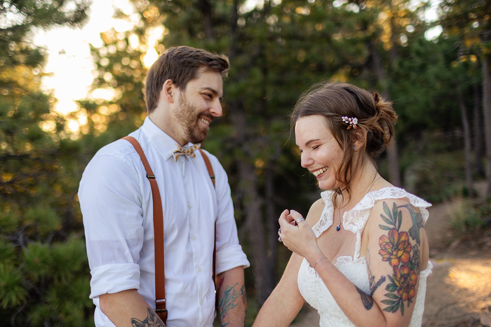 bride and groom laughing together after artist point elopement ceremony at sunrise 