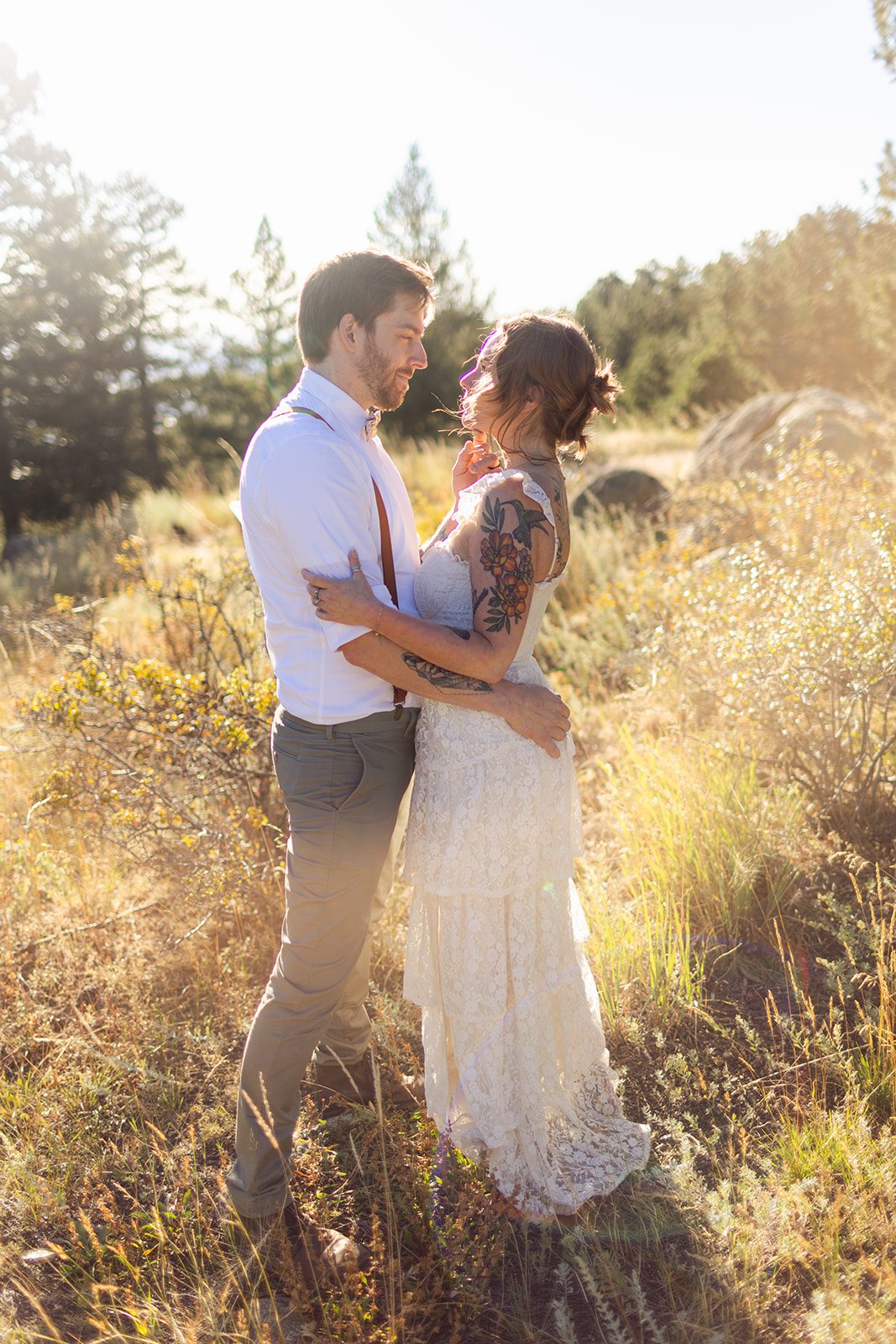 bride and groom in the sunlight at artist point, after sunrise elopement ceremony. 